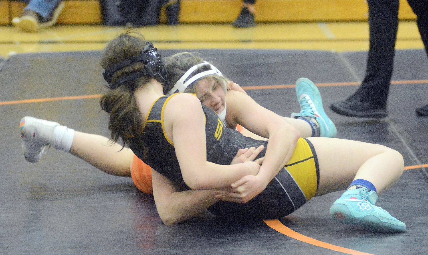 McKenzy Echols (right) looks to Sullivan’s Katie Summers on her back during the dual between the Dutchgirls and Lady Eagles.